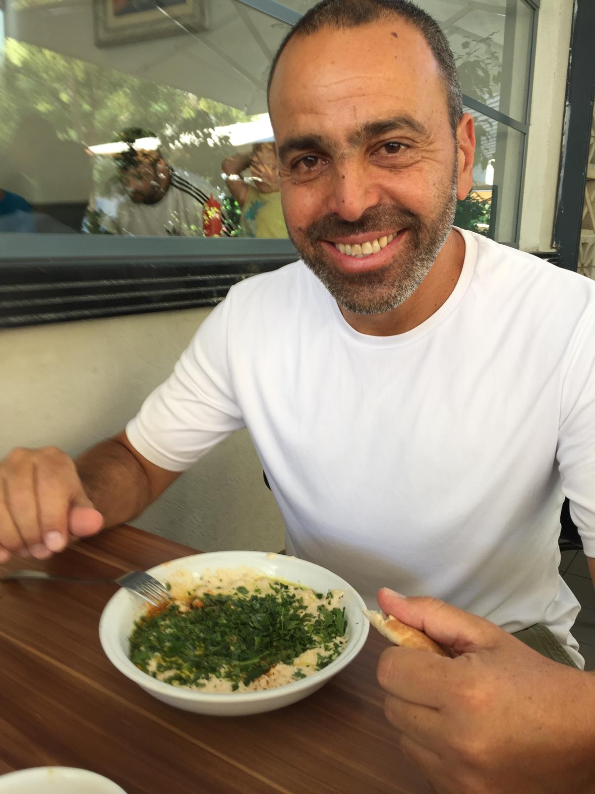 Ovdi enjoying hummus in Israel